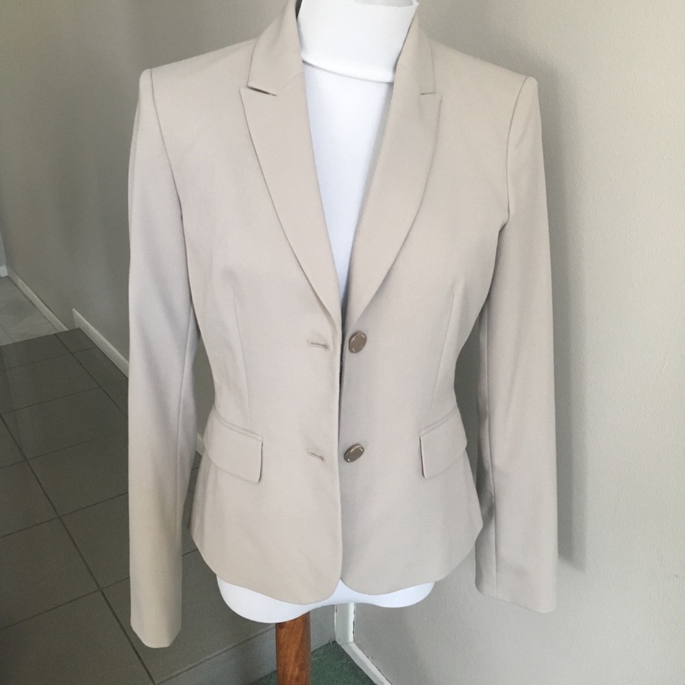 Beautiful Calvin Klein light beige suit with skirt